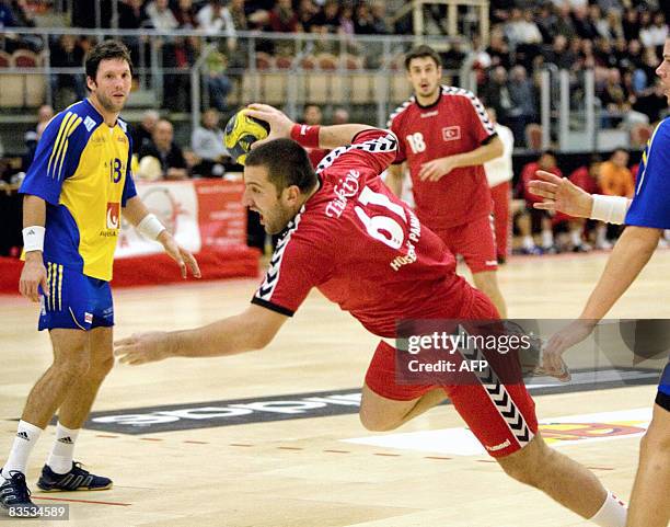 Turkey's Pamuk Hysein is pictured in action during the Men's European Handball Championships qualifying match between Sweden and Turkey in...