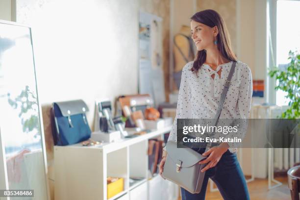 shopping in a showroom - handbag shop stock pictures, royalty-free photos & images