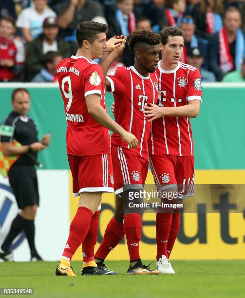 Kingsley Coman of Bayern Muenchen, Sebastian Rudy of Bayern Muenchen and Robert Lewandowski of Bayern Muenchen celebrate a goal during the DFB Cup...
