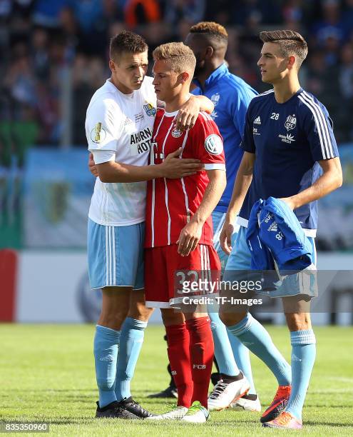 Daniel Frahn of Chemnitz and Joshua Kimmich of Bayern Muenchen looks on during the DFB Cup first round match between Chemnitzer FC and FC Bayern...