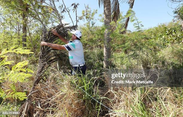 Scott Hend of Australia moves loose items in the rough on the 11th hole during day three of the 2017 Fiji International at Natadola Bay Championship...