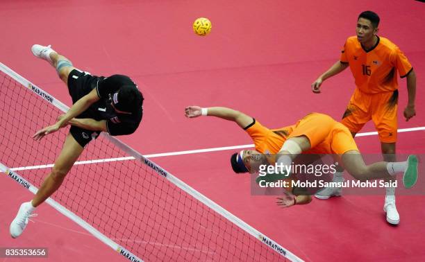 Anuwat Chaicana of Thailand blocks a ball during the Sepak Takraw Men's competition against Malaysia at the 2017 SEA Games on August 19, 2017 in...