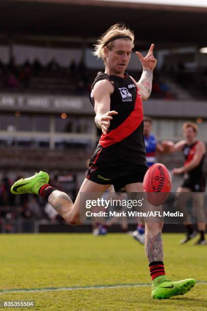 Ozgur Uysal of Essendon Bombers kicks out of defence during the round 18 VFL match between the Essendon Bombers and Footscray Bulldogs at Windy Hill...