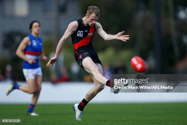 Nick Hind of Essendon Bombers kicks the ball into the foward line during the round 18 VFL match between the Essendon Bombers and Footscray Bulldogs...