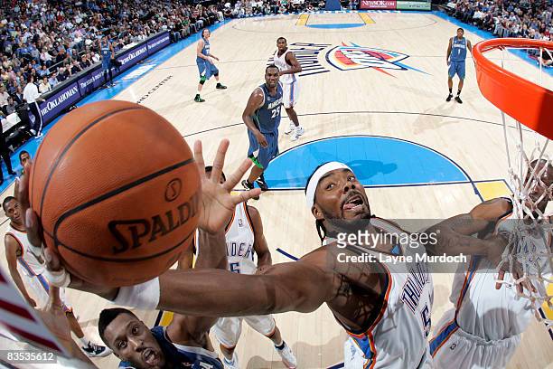 Chris Wilcox of the Oklahoma City Thunder snatches a rebound from defender Craig Smith of the Minnesota Timberwolves on November 2, 2008 at the Ford...