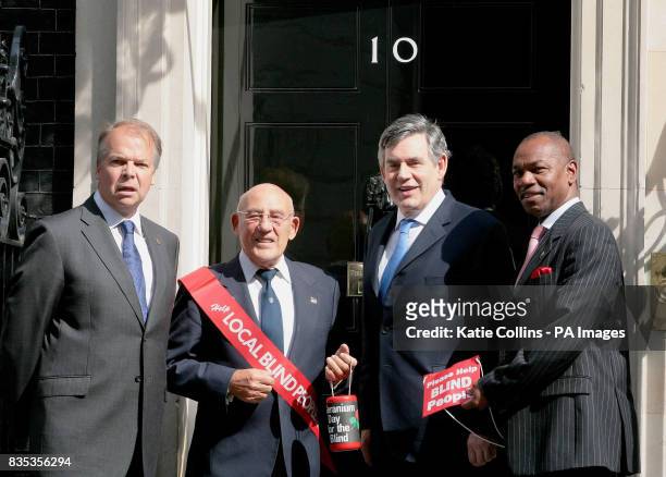 Prime Minister Gordon Brown is joined by Greater London Fund For The Blind Chairman, David Hawkins, Vice President of GLFB, Sir Stirling Moss, and...