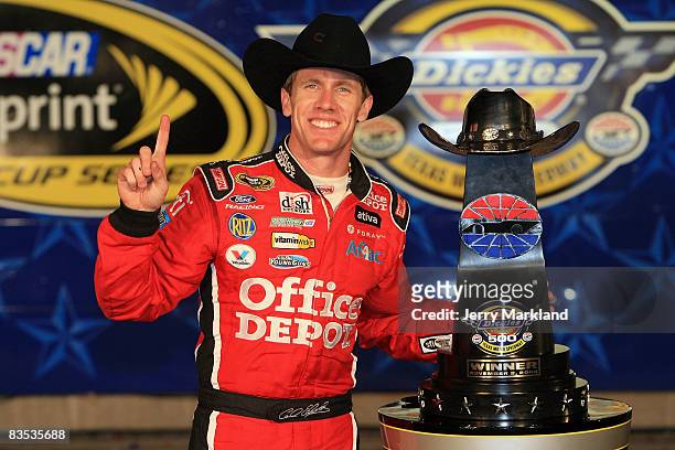 Carl Edwards, driver of the Office Depot Ford, poses in victory lane after winning the NASCAR Sprint Cup Series Dickies 500 at Texas Motor Speedway...