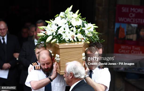 The coffin of helicopter co-pilot Richard Menzies is carried from his funeral service at Worcester Cathedral today.