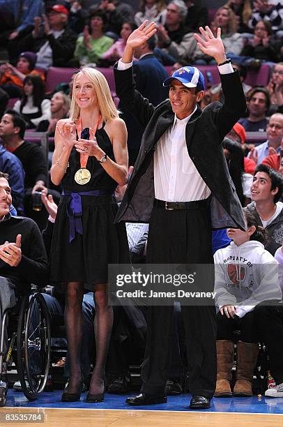 Marathon winners Paula Radcliffe and Marilson Gomes dos Santos attend the Milwaukee Bucks vs New York Knicks game at Madison Square Garden on...