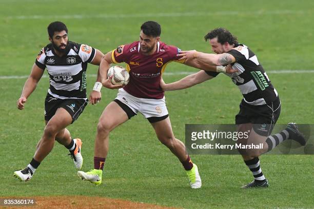 Matthew Johnson of Southland tries to get past Richard Buckman of Hawke's Bay during the round one Mitre 10 Cup match between the Hawke's Bay and...