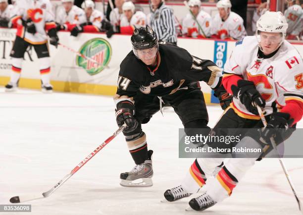 Dion Phaneuf of the Calgary Flames battles for position against Chris Kunitz of the Anaheim Ducks during the game on November 2, 2008 at Honda Center...