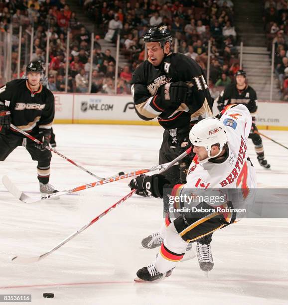 Todd Bertuzzi of the Calgary Flames slides into Ryan Getzlaf of the Anaheim Ducks during the game on November 2, 2008 at Honda Center in Anaheim,...