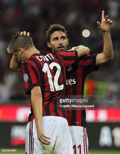 Fabio Borini of AC Milan celebrates his goal with his team-mate Andrea Conti during the UEFA Europa League Qualifying Play-Offs round first leg match...