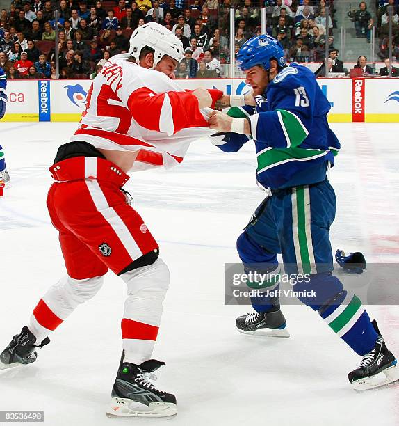 Mike Brown of the Vancouver Canucks and Darren McCarty of the Detroit Red Wings fight during their game at General Motors Place on November 2, 2008...