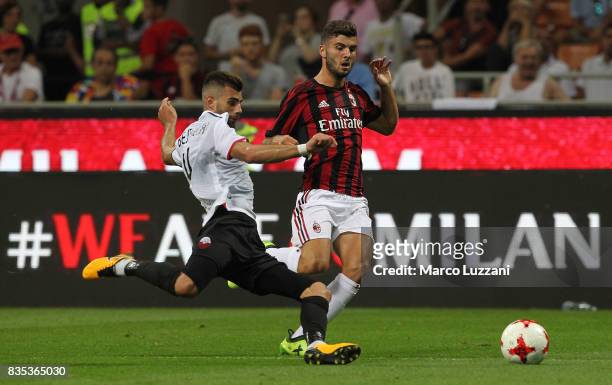 Patrick Cutrone of AC Milan is challenged by Egzon Bejtulai of KF Shkendija 79 during the UEFA Europa League Qualifying Play-Offs round first leg...