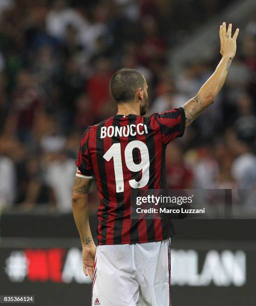 DuLeonardo Bonucci of AC Milan salute the crowd at the end of the UEFA Europa League Qualifying Play-Offs round first leg match between AC Milan and...