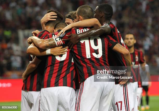 Andre Silva of AC Milan celebrates with his team-mates after scoring the opening goal during the UEFA Europa League Qualifying Play-Offs round first...