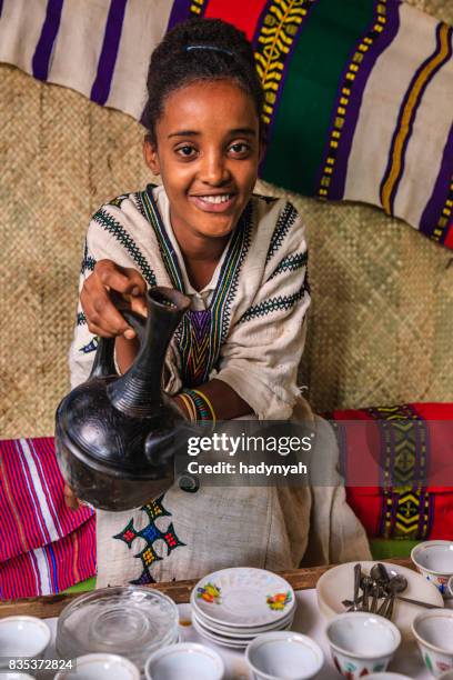 young african girl preparing coffee, ethiopia. east africa - ethiopian coffee ceremony imagens e fotografias de stock