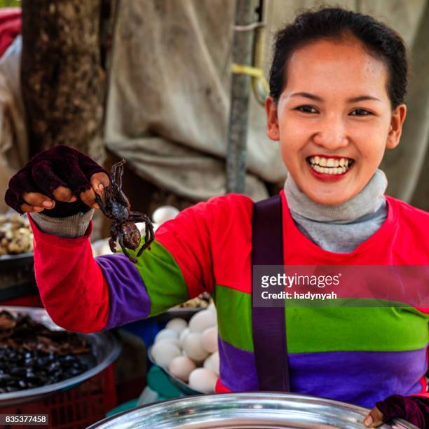 cambodian woman selling deep fried insects and tarantulas, cambodia - tarantula stock pictures, royalty-free photos & images