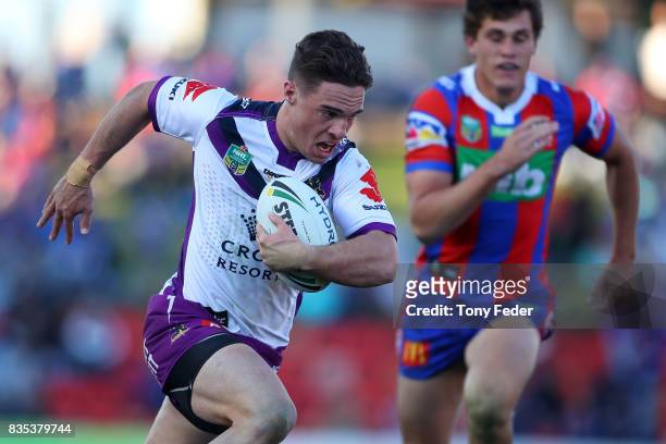 Brodie Croft of the Storm runs in to score a try during the round 24 NRL match between the Newcastle Knights and the Melbourne Storm at McDonald...