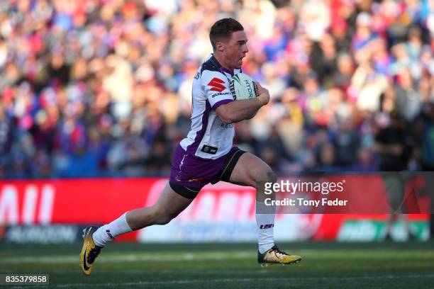 Brodie Croft of the Storm runs in to score a try during the round 24 NRL match between the Newcastle Knights and the Melbourne Storm at McDonald...
