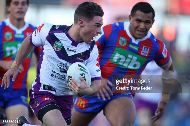 Brodie Croft of the Storm runs in to score a try during the round 24 NRL match between the Newcastle Knights and the Melbourne Storm at McDonald...