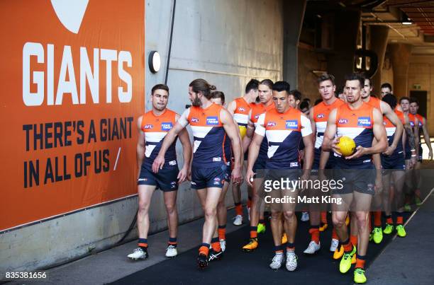 Giants walk through the race during the round 22 AFL match between the Greater Western Sydney Giants and the West Coast Eagles at Spotless Stadium on...
