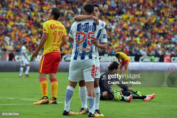 Victor Guzman of Pachuca celebrates with teammate Erick Aguirre after scoring the first goal of his team during the fifth round match between Morelia...