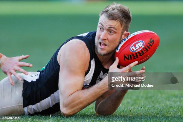 Ben Reid of the Magpies competes for the ball during the round 22 AFL match between the Collingwood Magpies and the Geelong Cats at Melbourne Cricket...