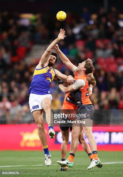 Josh Kennedy of the Eagles is challenged by Aidan Corr of the Giants during the round 22 AFL match between the Greater Western Sydney Giants and the...