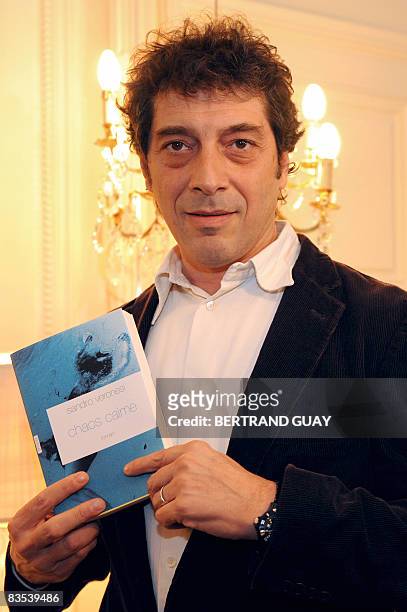 Italian writer Sandro Veronesi shows his novel "Chaos calme" on November 3, 2008 in Paris, after receiving Femina prize for best foreign author....
