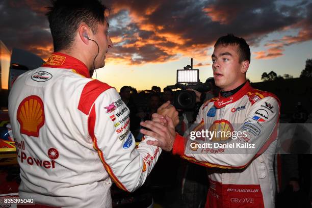 Race winner Fabian Coulthard driver of the Shell V-Power Racing Team Ford Falcon FGX is congratulated by his team mate Scott McLaughlin afte race 17...