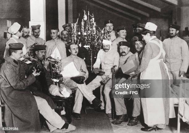Wounded German soldiers celebrate Christmas in hospital, Germany, circa 1916.