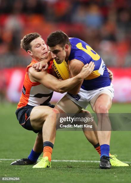 Elliot Yeo of the Eagles is challenged by Toby Greene of the Giants during the round 22 AFL match between the Greater Western Sydney Giants and the...