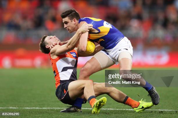 Elliot Yeo of the Eagles is challenged by Toby Greene of the Giants during the round 22 AFL match between the Greater Western Sydney Giants and the...