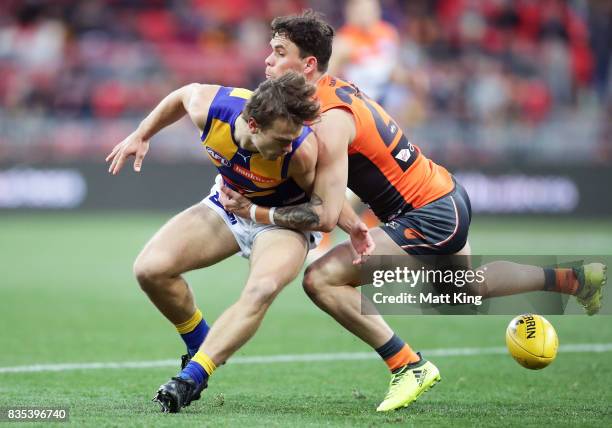 Zac Williams of the Giants competes for the ball against Luke Partington of the Eagles during the round 22 AFL match between the Greater Western...