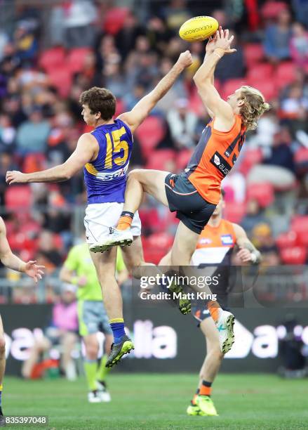 Nick Haynes of the Giants takes a mark over Jamie Cripps of the Eagles during the round 22 AFL match between the Greater Western Sydney Giants and...