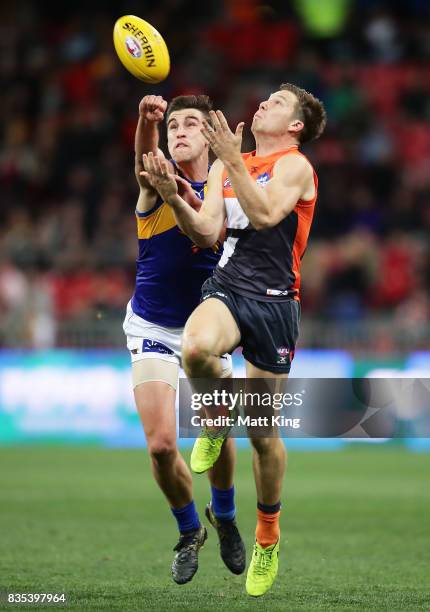 Toby Greene of the Giants is challenged by Elliot Yeo of the Eagles during the round 22 AFL match between the Greater Western Sydney Giants and the...