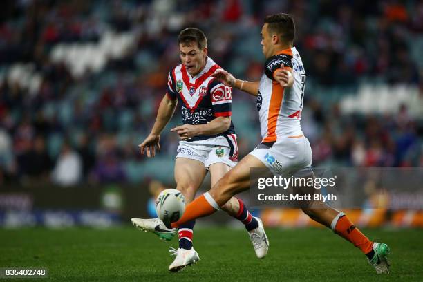 Luke Keary of the Roosters kicks the ball during the round 24 NRL match between the Sydney Roosters and the Wests Tigers at Allianz Stadium on August...