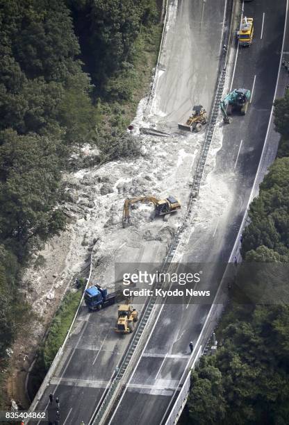 Photo taken Aug. 19 from a Kyodo News helicopter shows the scene of a landslide on the Chuo Expressway in Mizunami, Gifu Prefecture, central Japan....