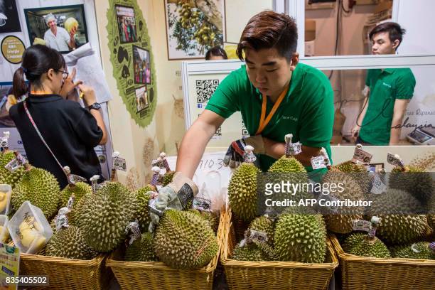 Vendor puts out durian fruit for sale at the food expo in Hong Kong on August 19, 2017. This years food expo, held at the Hong Kong Exhibition and...