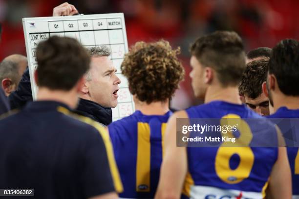 Eagles head coach Adam Simpson speaks to players at three quarter time during the round 22 AFL match between the Greater Western Sydney Giants and...