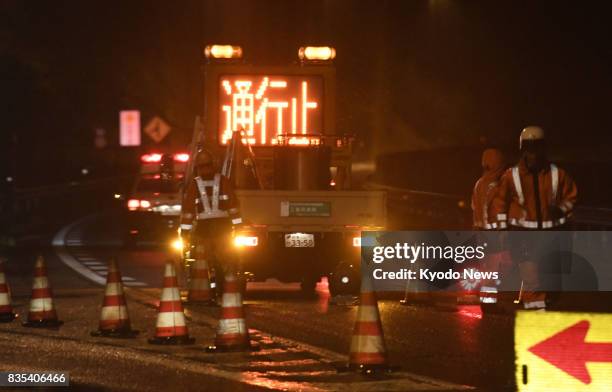 Road closed sign is positioned near the Mizunami interchange in Mizunami, Gifu Prefecture, central Japan, on Aug. 18 after a landslide occurred on...