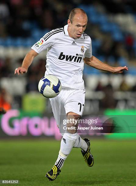 Arjen Robben of Real Madrid runs with the ball during the La Liga match between Almeria and Real Madrid at the Estadio de los Juegos Mediterraneos on...