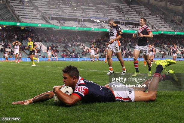 Latrell Mitchell of the Roosters scores a try during the round 24 NRL match between the Sydney Roosters and the Wests Tigers at Allianz Stadium on...
