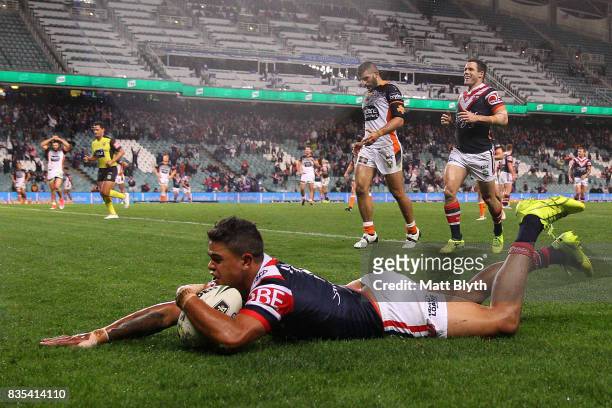 Latrell Mitchell of the Roosters scores a try during the round 24 NRL match between the Sydney Roosters and the Wests Tigers at Allianz Stadium on...