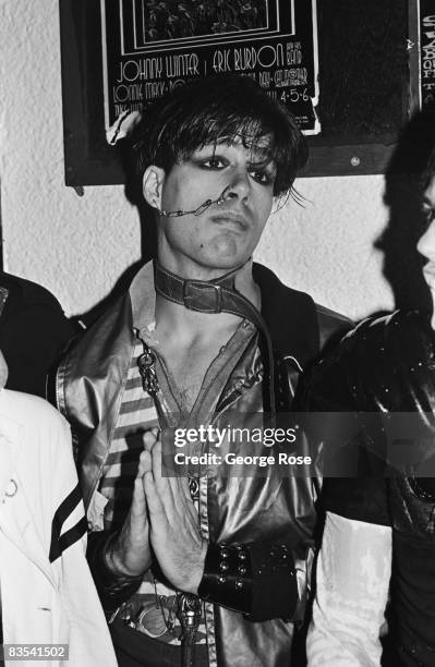 Punk fan with a pierced nose and cheek attends "The Sex Pistols" performance in this 1978 San Francisco, California, photo taken at the Winterland...