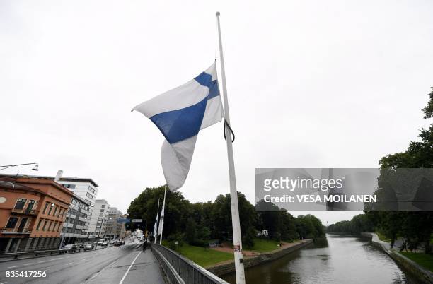 Finnish flag flies at half-mast in Turku, Finland on August 19, 2017. - Two people were killed and six were injured in a stabbing spree in the...