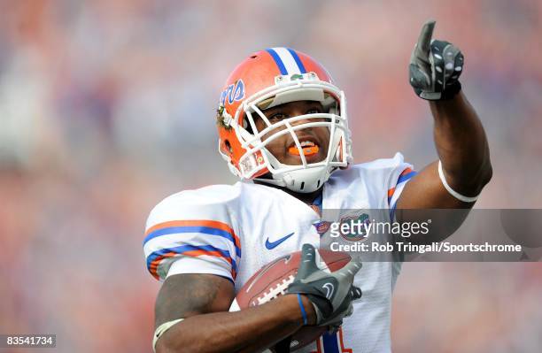 Running Back Percy Harvin of the Florida Gators runs for a touchdown against the Georgia Bulldogs at Jacksonville Municipal Stadium on November 1,...