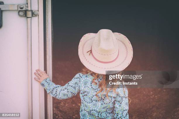 back view of a four year old little cowgirl with her nice blouse and hat. - year in focus trailer stock pictures, royalty-free photos & images